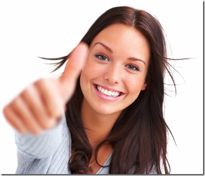 Portrait of attractive young female showing a thumbs up on white background